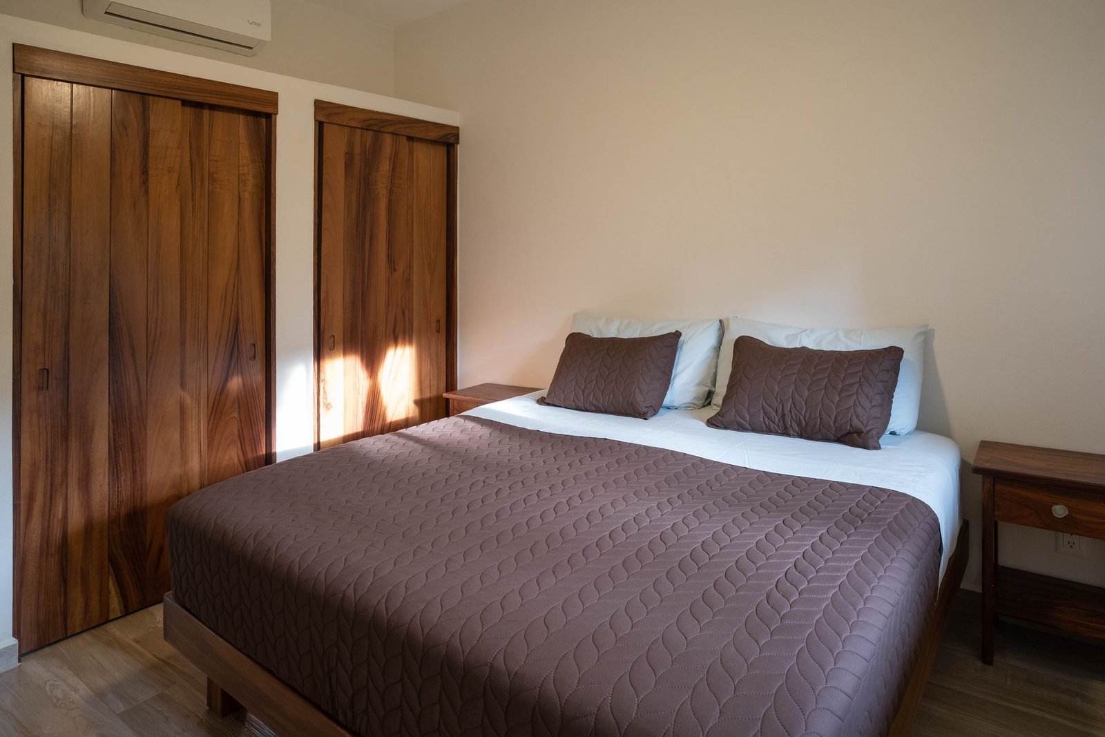 Bedroom at Casa Nisha with full-height parota wood closets and air conditioning